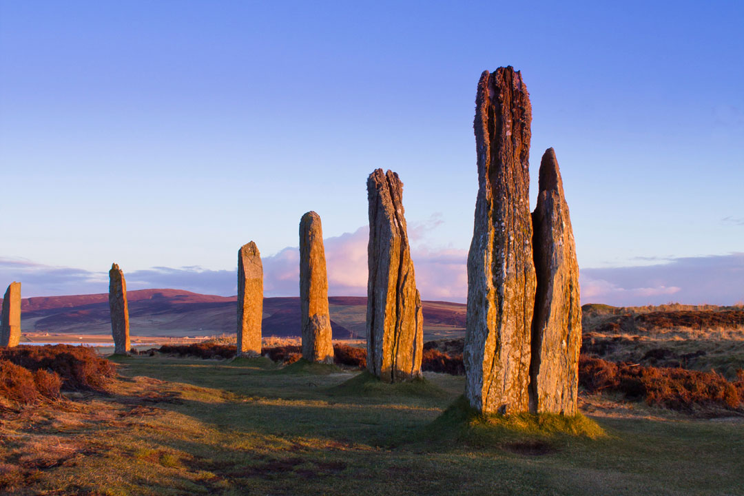 Huge tall, slim standing stones of the Ring of Brodgar in evening light, Orkney Islands