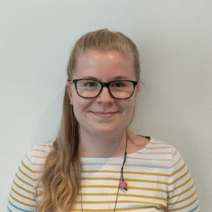 Bogi is stood facing the camera and then all of a sudden four phones appear into frame as if to say 'these calls are for you bogi'