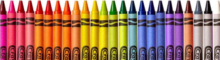A row of crayola wax crayons in colour order
