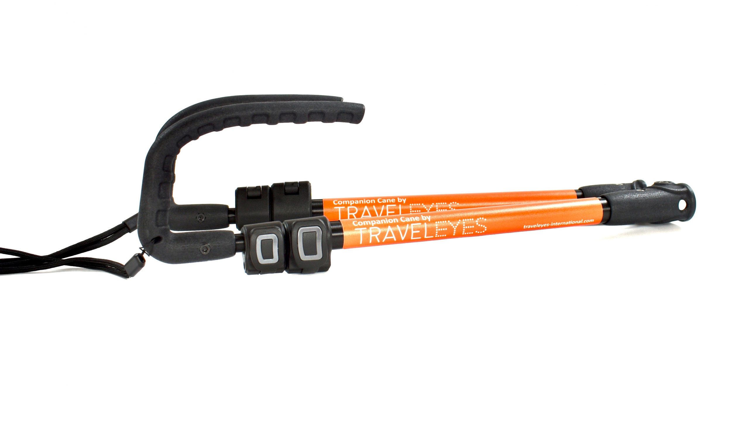 Photo description: A close up of the Companion Cane folded to its smallest size. The handles are black with wrist straps and the Traveleyes Logo in orange is along the poles of the cane