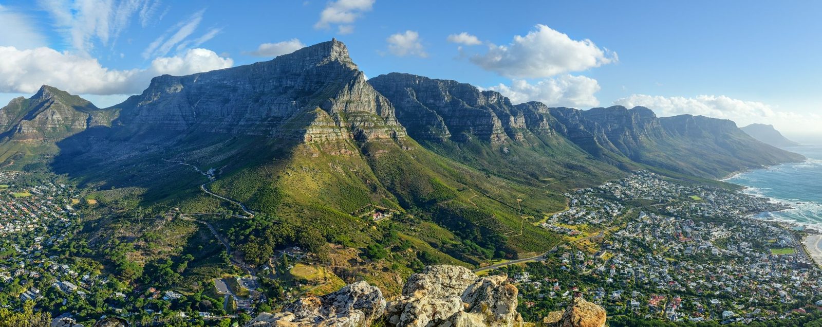The green slopes and rocky 
