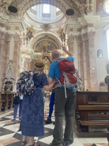 Jackson describes the intricate detail of the interior of the baroque cathedral in Innsbruck to Caroline