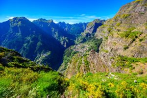 Mountain village nestled deep within the steep green peaks of Nuns’ Valley