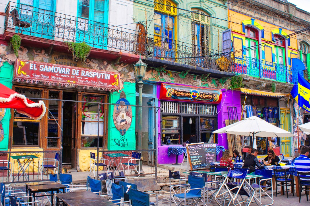 Colourful cafés in La Boca, Buenos Aires Brightly painted buildings, wrought-iron balconies and outdoor café tables in the colourful La Boca neighbourhood of Buenos Aires