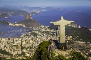 Christ the Redeemer statue overlooking Rio de Janeiro, with Sugarloaf Mountain, Guanabara Bay and the city spread below