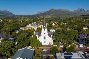 Aerial view of Stellenbosch Church set among the green Mountains