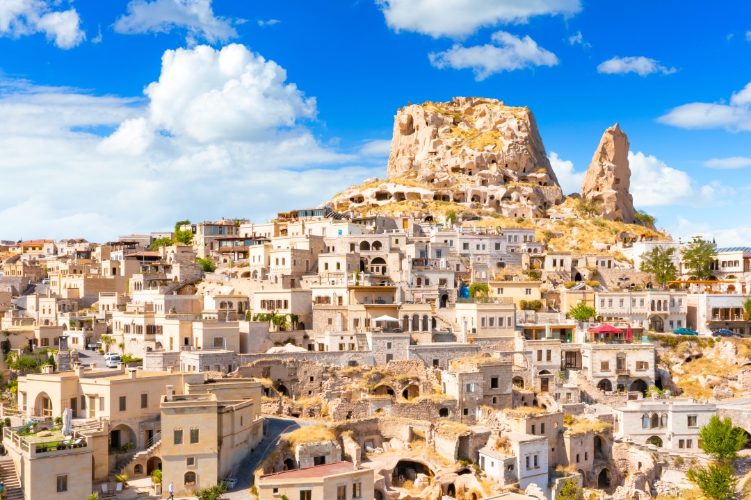 Uchisar Castle Stone houses and cave dwellings clustered beneath Uçhisar Castle, Cappadocia
