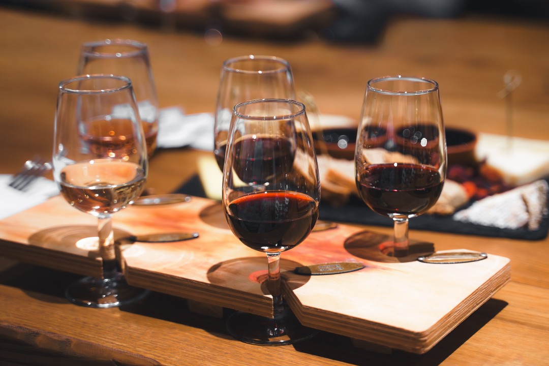 Portuguese Wine Tasting Glasses of wine arranged on wooden tasting boards at a wine tasting